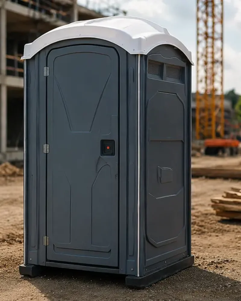 Portable Toilets For Construction Sites Placed Near Active Building Project